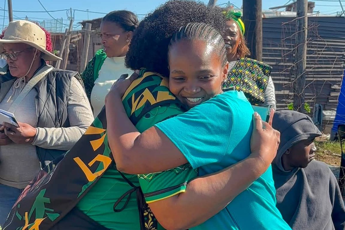 ANC Nelson Mandela Bay Regional Chairperson Babalwa Lobishe embraces a resident during the voter registration drive