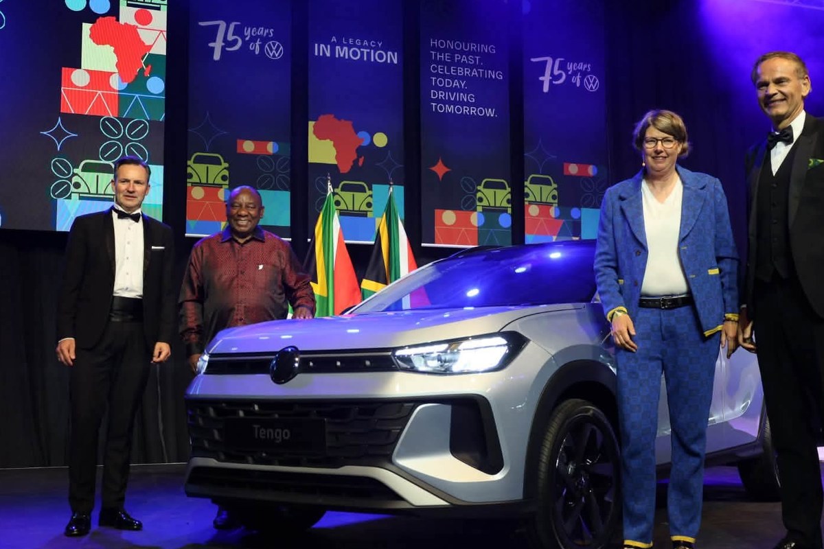President Cyril Ramaphosa, Martina Biene and Volkswagen executives with the newly unveiled silver Volkswagen Tengo on stage at the gala dinner