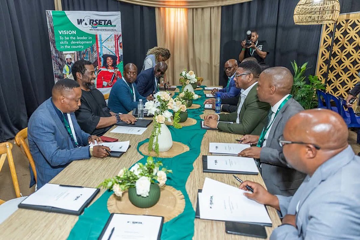 Minister Buti Manamela engaging with officials and stakeholders at the handover event for the W&RSETA Cellphone Repair Programme