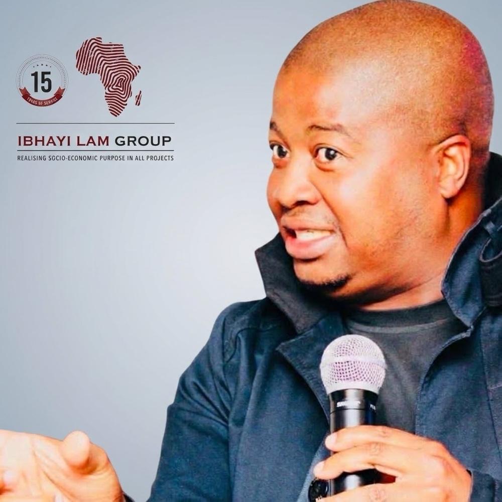 Bongani Mabusela holding a microphone.